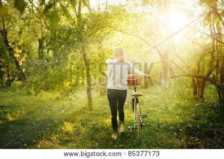 Blurred Image Of Female With Bicycle
