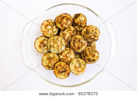 Indian cuisine ~ fried puffed balls made from mould filled with dough of rice powder and fillings