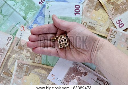 Money And A Hand With A House