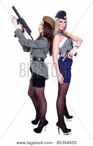 Two Women In The Military Uniform With A Guns
