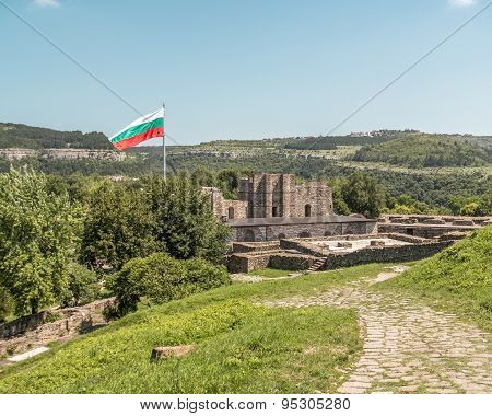 Bulgarian Flag Flying Over Ruins Of Medieval Fortress. Tsarevets, Veliko Tarnovo, Bulgaria