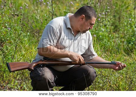 The Shooter Cleans The Barrel Of Rifle