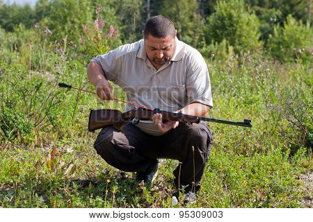 The Shooter With Rifle And Ramrod