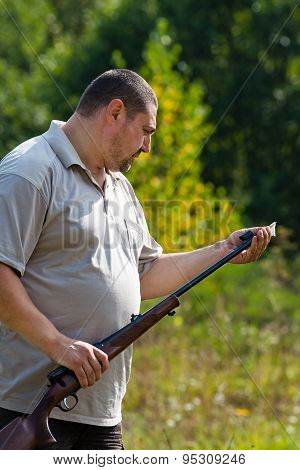 Hunter Cleans Weapon