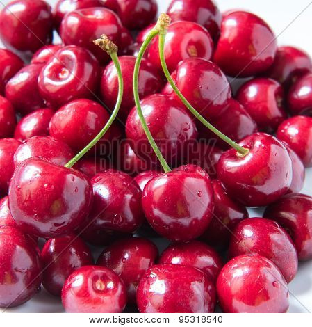 Bowl Of Red Fresh Cerries On A White Background