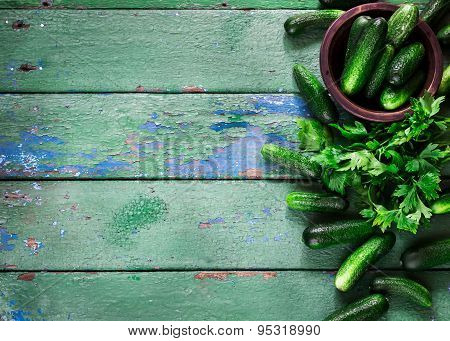 Cucumbers On Old Green  Wooden Table.