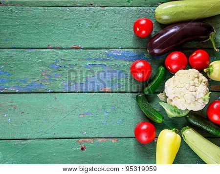 Cucumbers On Old Green  Wooden Table.