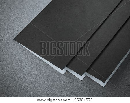 Three blank half-fold brochures