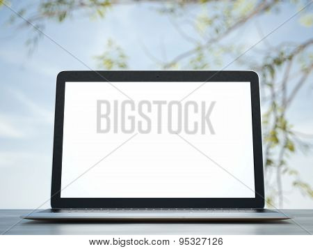 computer on a background of blue sky