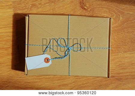 Mail package parcel on wooden table, top view