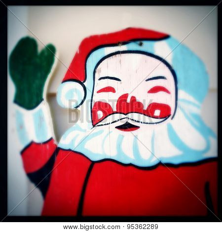Instagram filtered image of vintage wooden Santa Claus
