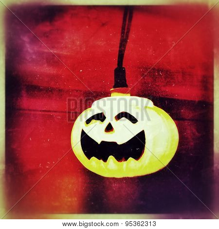 Instagram filtered image of a Halloween pumpkin light