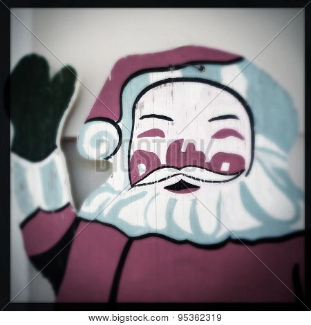 Instagram filtered image of vintage wooden Santa Claus