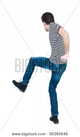 back view skinny guy funny fights waving his arms and legs. Isolated over white background.Rear view people collection. backside view of person. Funny guy clumsily boxing. guy in striped shirt jumping