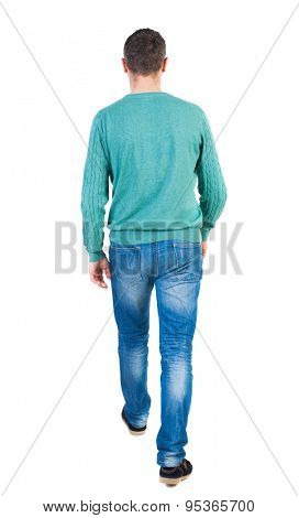 Back view of going  handsome man in jeans and a shirt.  walking young guy . Rear view people collection.  backside view person. Isolated over white background. The guy in green jacket comes back to us