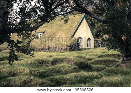 Hofskirkja - a small turf-top church and graveyard in Hof, Iceland