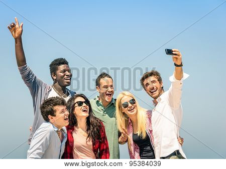 Group Of Multiracial Friends Taking A Selfie On The Blue Sky - Concept Of Happiness And Friendship