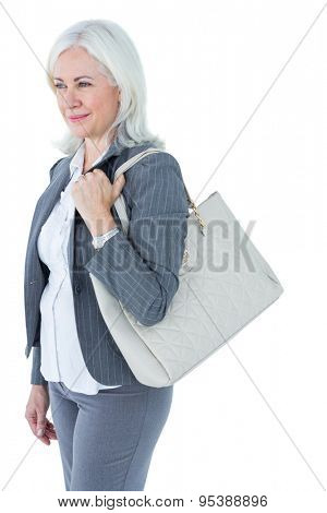 Businesswoman with bag against white background