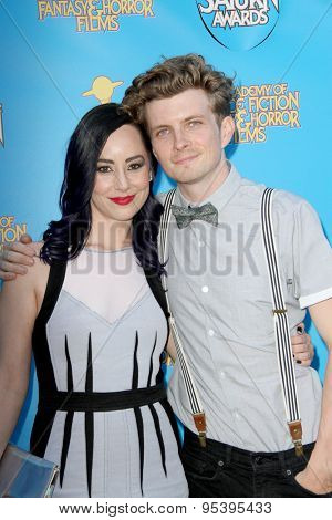 BURBANK - JUNE 25: Erik Knudsen and guest arrive at the 41st Annual Saturn Awards on Thursday, June 25, 2015 at the Castaway Restaurant in Burbank, CA.