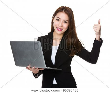 Businesswoman use of the laptop computre and thumb up