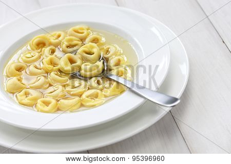 tortellini in brodo, ring shaped pasta in broth, italian emilia romagna soup cuisine