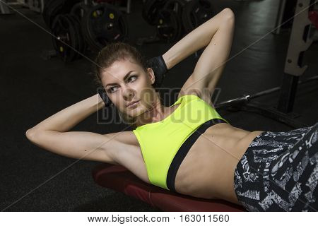 Young Woman Goes In For Sports At Gym