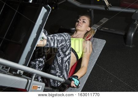 Young Woman Goes In For Sports At Gym