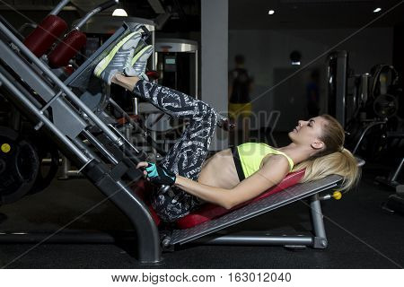 Young Woman Goes In For Sports At Gym