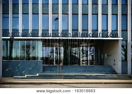 COLOGNE, GERMANY - NOVEMBER 24: The facade and the entrance of the institute of the German economy with logo and glass revolving doors on November 24, 2016 in Cologne.