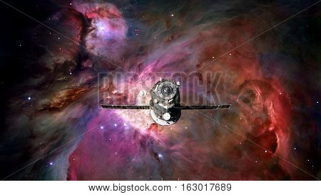 Spacecraft Progress orbiting the space nebula. Elements of this image furnished by NASA.