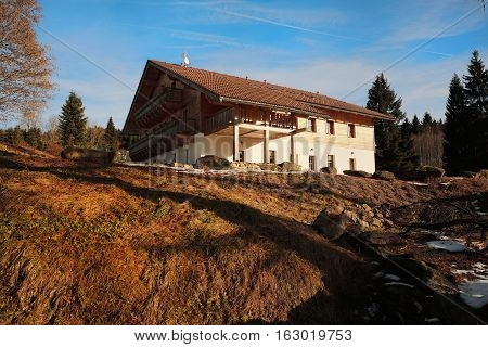 Cottage from the winter Mountains Sumava in southern Czech