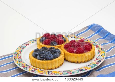 Delicious little fruit tarts to the coffee