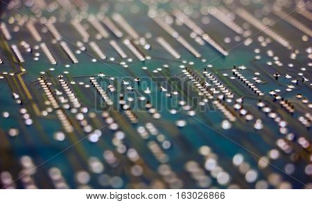 Circuit Board. The reverse side of the motherboard closeup. Selective focus