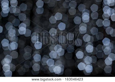Abstract night background blur of blue and white points of light
