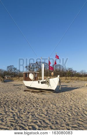 Fishing Boat On Shore Of The Baltic Sea In Koserow, Germany.