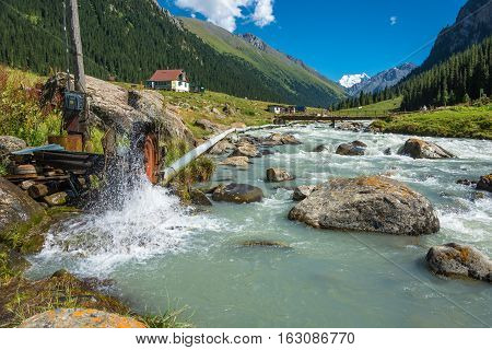A small hydroelectric dam on a wild river Arashan Kyrgyzstan.