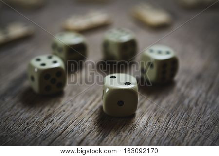 dice closeup on a wooden table, game abstract