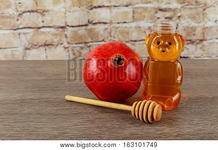Jewish holiday jewish symbol Holiday symbo Jewish holiday Jewish new year. Rosh Hashana apples honey and pomegranates on a dark wood background traditional food for the Jewish new year. Rosh Hashana. selective focus on the middle of the honey