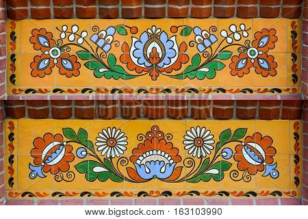 Ethnic ceramic decoration on the wall. Opishnya Poltavska oblast Ukraine.