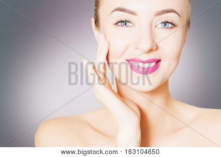 portrait of beautiful smiling woman with perfect skin