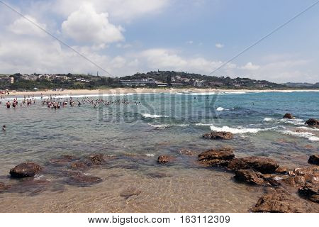 People On Early Morning Beach At Scottburgh In  South Africa