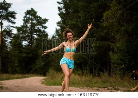 Girl In Bathing Suit In The Forest
