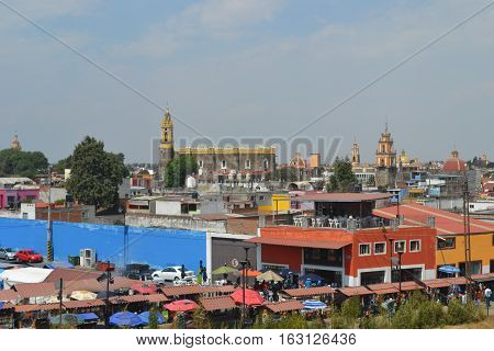 View of the city of Cholula from the top of a pyramid. The city has over 365 church so no matter where you look you will see one or more. Puebla, Mexico
