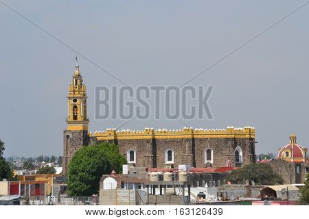 View of the city of Cholula from the top of a pyramid. The city has over 365 church so no matter where you look you will see one or more. Puebla, Mexico