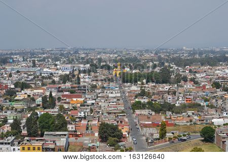 View of the city of Cholula from the top of a pyramid. The city has over 365 church so no matter where you look you will see one or more. Puebla, Mexico