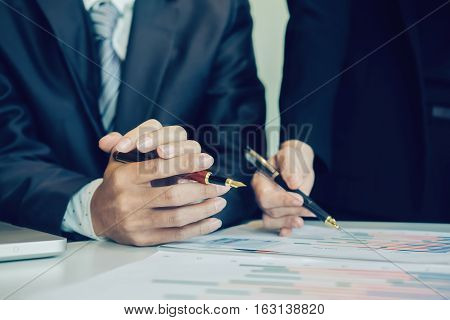 Teamwork Concept. business team work working plan the business and analysis many chart graph. Film effected photo.