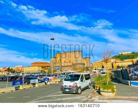 Napoly, Italy - May 04, 2014: Castel dellOvo and cars at port area at Napoly, Italy on May 04, 2014