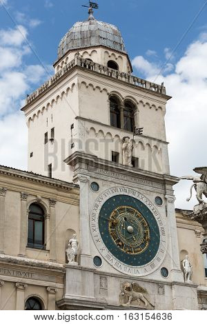 PADUA, ITALY - MAY 3, 2016: Clock tower building of medieval origins overlooking Piazza dei Signori in Padova Italy