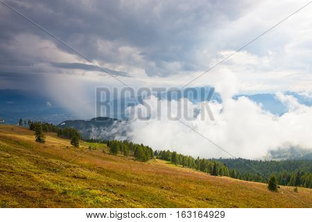Dramatic evening in Gerlitzen Apls before stormAustria.Inverse weather and view of the mountains in Slovenia.