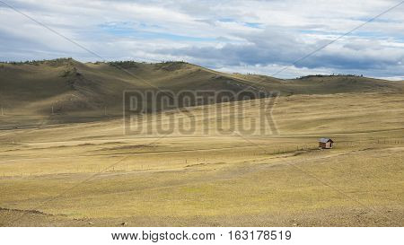 Steppe in Siberian. Baikal. Mountains. Prairie. Blue sky. Rural. Adventure